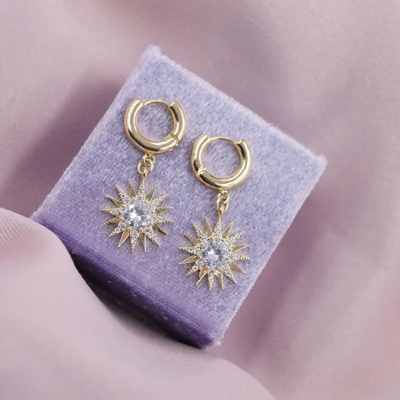 Classic hoop earrings with a thin profile for a sleek and subtle style-Starburst Huggie Hoops